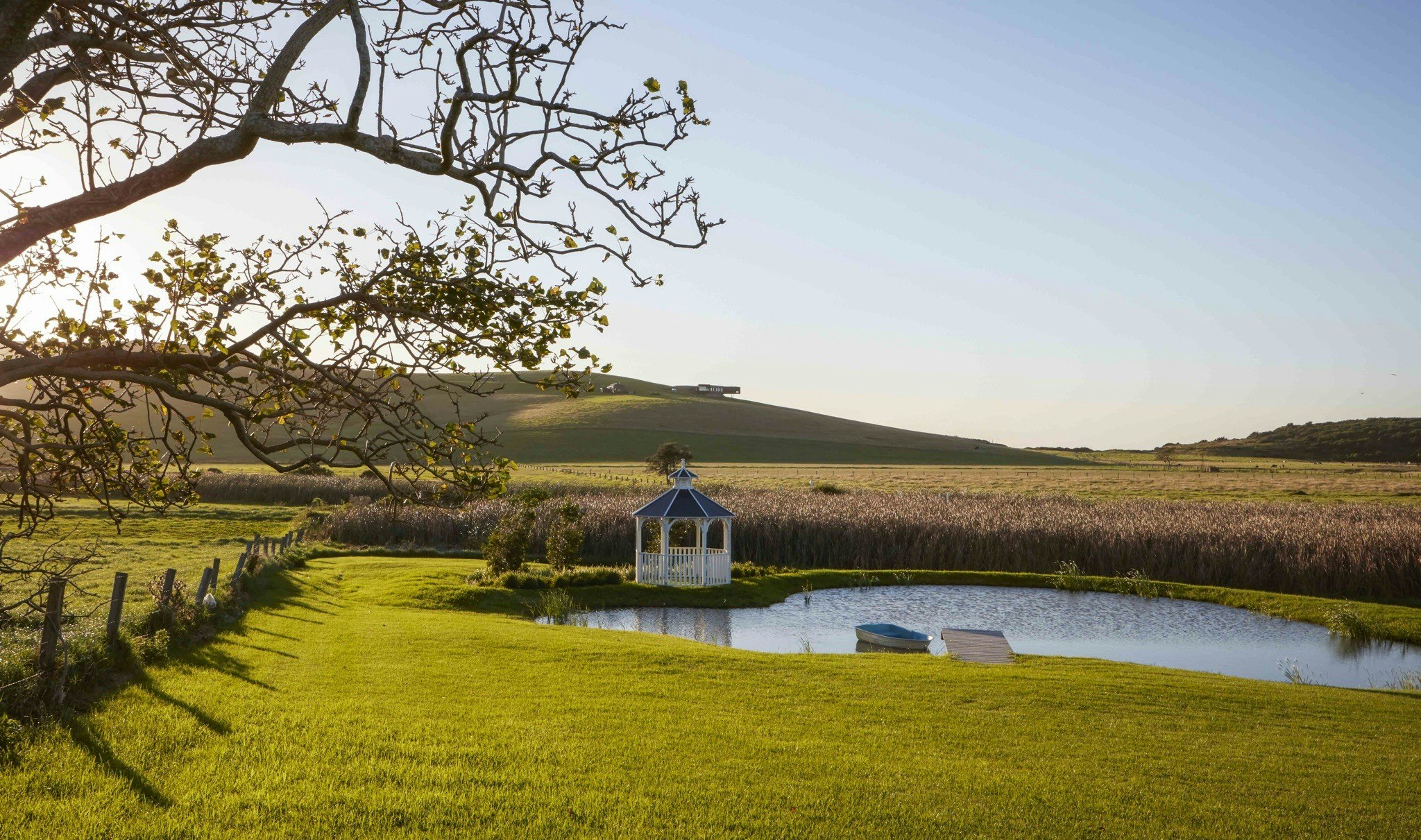 Outside Seacliff House with view of dam and gazebo.